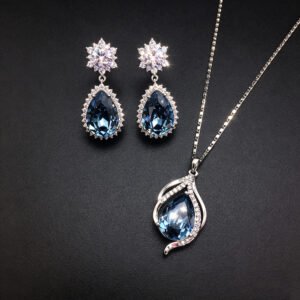 Wholesale crystal jewelry set featuring white gold plated copper with magenta pink teardrop Swarovski element crystals from JuneJewelry.com.