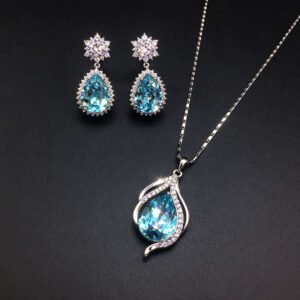 Wholesale crystal jewelry set featuring white gold plated copper with magenta pink teardrop Swarovski element crystals from JuneJewelry.com.