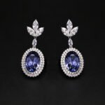 Wholesale blue crystal earrings featuring Swarovski Element crystals on platinum plated brass from JuneJewelry.com – high quality luxury dangle earrings for bulk orders.