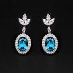 Wholesale blue crystal earrings featuring Swarovski Element crystals on platinum plated brass from JuneJewelry.com – high quality luxury dangle earrings for bulk orders.
