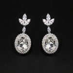 Wholesale blue crystal earrings featuring Swarovski Element crystals on platinum plated brass from JuneJewelry.com – high quality luxury dangle earrings for bulk orders.