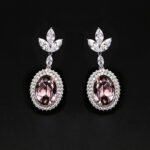 Wholesale blue crystal earrings featuring Swarovski Element crystals on platinum plated brass from JuneJewelry.com – high quality luxury dangle earrings for bulk orders.