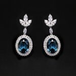 Wholesale blue crystal earrings featuring Swarovski Element crystals on platinum plated brass from JuneJewelry.com – high quality luxury dangle earrings for bulk orders.