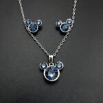 Wholesale Mickey jewelry set featuring white gold plated copper with pink Swarovski element crystals from JuneJewelry.com.