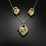 Wholesale lock jewelry set made of white gold plated copper with yellow heart Swarovski element crystals and key charm from JuneJewelry.com.