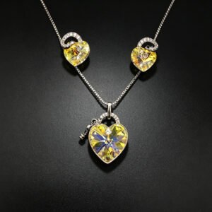 Wholesale lock jewelry set made of white gold plated copper with yellow heart Swarovski element crystals and key charm from JuneJewelry.com.