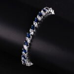 Wholesale Ruby Zircon Bracelet featuring red and clear marquise stones on platinum plated copper from JuneJewelry.com