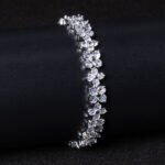 Wholesale Floral Zircon Bracelet featuring four-petal flower CZ stones on platinum plated copper from JuneJewelry.com