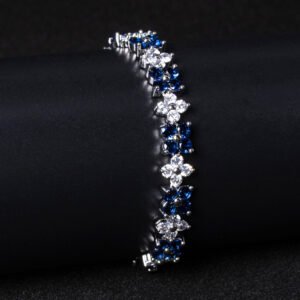 Wholesale Floral Zircon Bracelet featuring four-petal flower CZ stones on platinum plated copper from JuneJewelry.com
