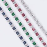 Wholesale Floral Zircon Bracelet featuring four-petal flower CZ stones on platinum plated copper from JuneJewelry.com