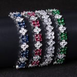 Wholesale Floral Zircon Bracelet featuring four-petal flower CZ stones on platinum plated copper from JuneJewelry.com