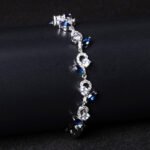 Wholesale Leaf Zircon Bracelet featuring flower and marquise leaf CZ stones on platinum plated copper from JuneJewelry.com