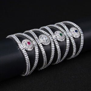 Wholesale Crystal Bangle Bracelet featuring double row baguette stones and red sunburst halo on platinum plated copper from JuneJewelry.com.