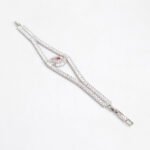 Wholesale Crystal Bangle Bracelet featuring double row baguette stones and red sunburst halo on platinum plated copper from JuneJewelry.com.