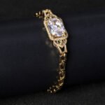 Wholesale Radiant Zircon Bracelet with cushion-cut main stone and filigree halo on platinum plated copper from JuneJewelry.com.