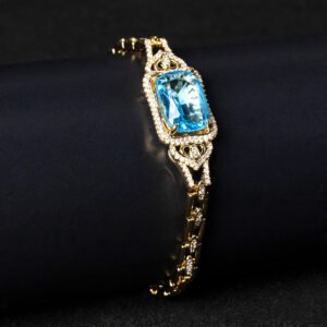 Wholesale Radiant Zircon Bracelet with cushion-cut main stone and filigree halo on platinum plated copper from JuneJewelry.com.