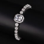 Wholesale Halo Zircon Bracelet featuring octagonal center stone and round halo chain on platinum plated copper from JuneJewelry.com.