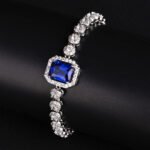 Wholesale Halo Zircon Bracelet featuring octagonal center stone and round halo chain on platinum plated copper from JuneJewelry.com.