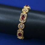 Wholesale Royal Zircon Bracelet featuring aqua blue gemstones in milgrain gold plated copper from JuneJewelry.com.