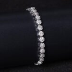 Wholesale Floral Zircon Bracelet with round paved cluster links on platinum plated copper from JuneJewelry.com