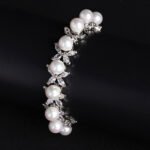 Wholesale Pearl Zircon Bracelet featuring white shell pearls and marquise CZ gems on platinum plated copper from JuneJewelry.com