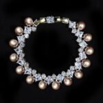 Wholesale Square Pearl Bracelet featuring princess-cut CZ stones and shell pearls on platinum plated copper from JuneJewelry.com