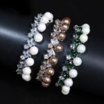 Wholesale Square Pearl Bracelet featuring princess-cut CZ stones and shell pearls on platinum plated copper from JuneJewelry.com