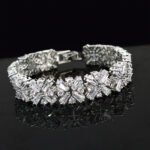Wholesale Crystal Zircon Bracelet with baguette and round CZ snowflake links on platinum plated copper from JuneJewelry.com