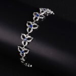 Wholesale Clover Zircon Bracelet with openwork pavé clover links on platinum plated copper from JuneJewelry.com