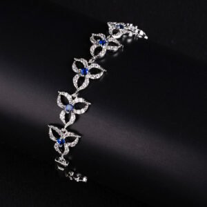 Wholesale Clover Zircon Bracelet with openwork pavé clover links on platinum plated copper from JuneJewelry.com