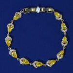 Wholesale Teardrop Zircon Bracelet with pear-cut CZ stones on platinum plated copper from JuneJewelry.com