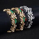 Wholesale Wave Zircon Bracelet featuring paved wave links and solitaire CZ gems on platinum plated copper from JuneJewelry.com