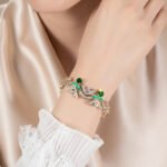 Wholesale Wave Zircon Bracelet featuring paved wave links and solitaire CZ gems on platinum plated copper from JuneJewelry.com