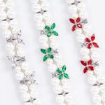 Wholesale Pearl Zircon Bracelet featuring double-strand pearls and CZ flower connectors on platinum plated copper from JuneJewelry.com