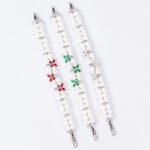 Wholesale Pearl Zircon Bracelet featuring double-strand pearls and CZ flower connectors on platinum plated copper from JuneJewelry.com