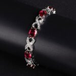 Wholesale Infinity Zircon Bracelet featuring oval CZ gems and paved cross links on platinum plated copper from JuneJewelry.com
