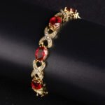 Wholesale Infinity Zircon Bracelet featuring oval CZ gems and paved cross links on platinum plated copper from JuneJewelry.com