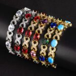 Wholesale Infinity Zircon Bracelet featuring oval CZ gems and paved cross links on platinum plated copper from JuneJewelry.com
