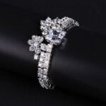 Wholesale Crown Zircon Bracelet with square princess cut centerpiece and CZ flower clusters on platinum plated copper from JuneJewelry.com