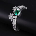 Wholesale Crown Zircon Bracelet with square princess cut centerpiece and CZ flower clusters on platinum plated copper from JuneJewelry.com