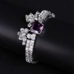 Wholesale Crown Zircon Bracelet with square princess cut centerpiece and CZ flower clusters on platinum plated copper from JuneJewelry.com