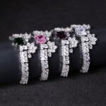 Wholesale Crown Zircon Bracelet with square princess cut centerpiece and CZ flower clusters on platinum plated copper from JuneJewelry.com