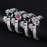 Wholesale Crown Zircon Bracelet with square princess cut centerpiece and CZ flower clusters on platinum plated copper from JuneJewelry.com