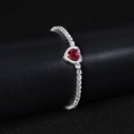Wholesale Heart Zircon Bracelet featuring a paved heart centerpiece on a tennis chain with platinum plated copper from JuneJewelry.com