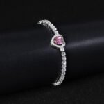 Wholesale Heart Zircon Bracelet featuring a paved heart centerpiece on a tennis chain with platinum plated copper from JuneJewelry.com