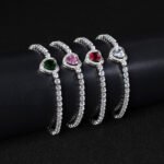 Wholesale Heart Zircon Bracelet featuring a paved heart centerpiece on a tennis chain with platinum plated copper from JuneJewelry.com