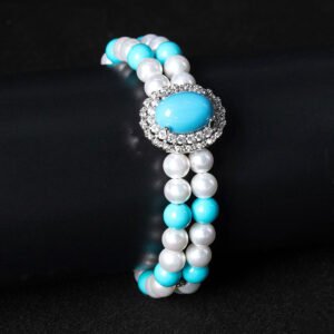 Wholesale Emerald Zircon Bracelet with green oval gem halo centerpiece and double-row pearl strands on platinum plated copper from JuneJewelry.com