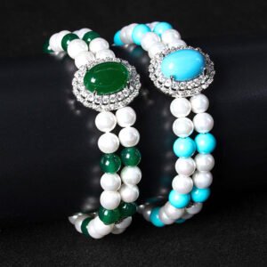 Wholesale Emerald Zircon Bracelet with green oval gem halo centerpiece and double-row pearl strands on platinum plated copper from JuneJewelry.com