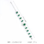 Wholesale Emerald Zircon Bracelet with green oval gem halo centerpiece and double-row pearl strands on platinum plated copper from JuneJewelry.com