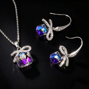 Wholesale ribbon crystal jewelry set featuring platinum plated copper with blue-purple cube Swarovski element crystals from JuneJewelry.com.